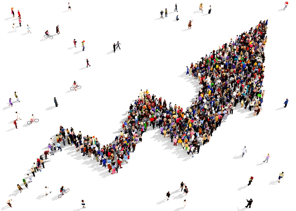 Crowd creating a positive line graph