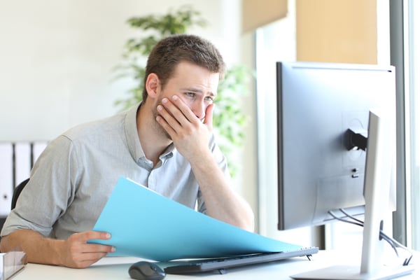 Frustrated Salesman at computer