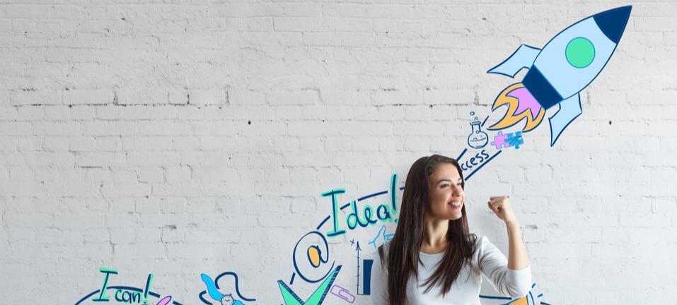 Marketer with graffiti behind her