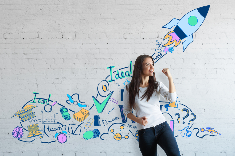 Marketer with graffiti behind her